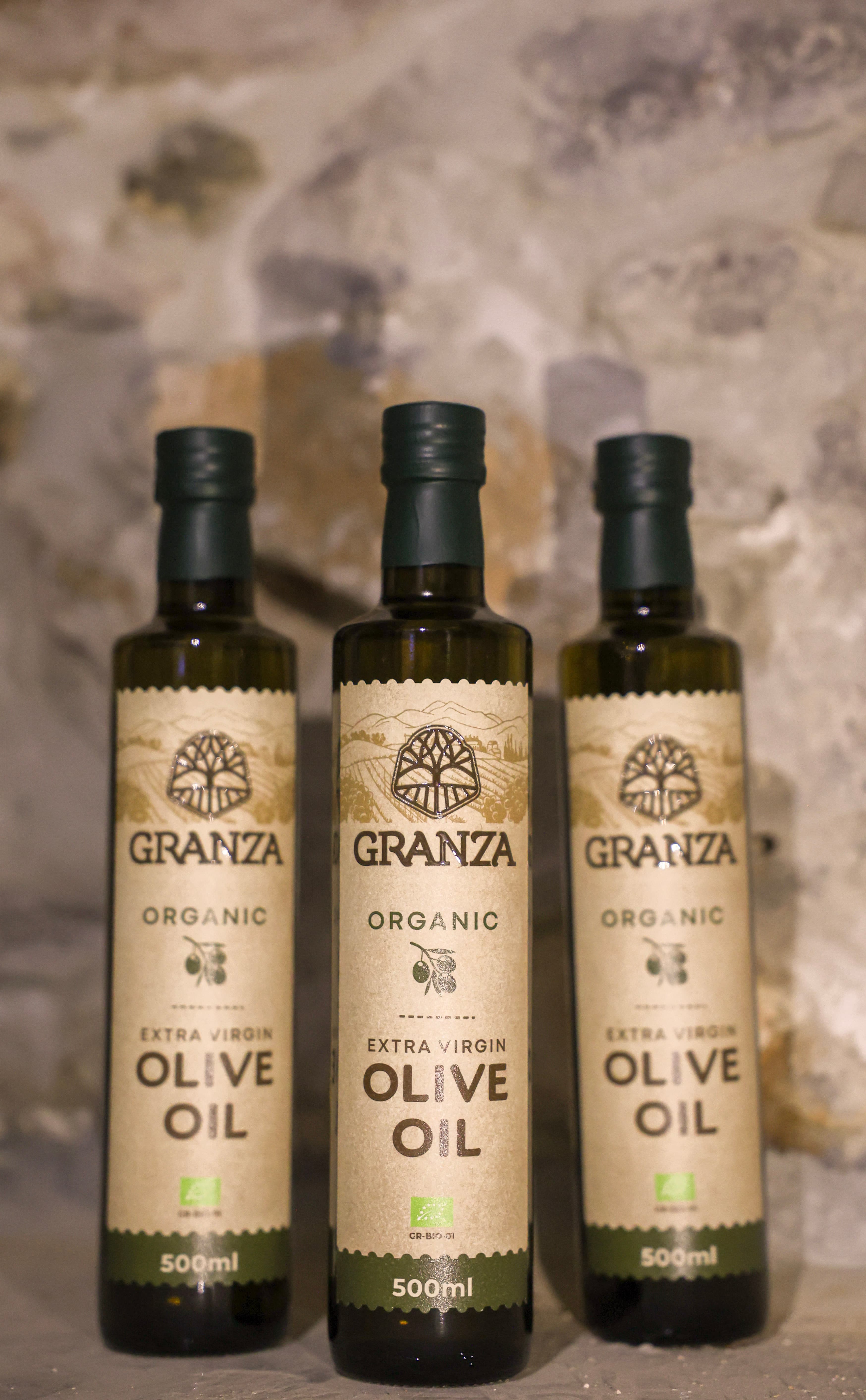 Granza olive oil bottles in Greek setting
